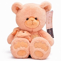 Мягкая игрушка KULT Медведь Глэм с бантом h25см карамельный 